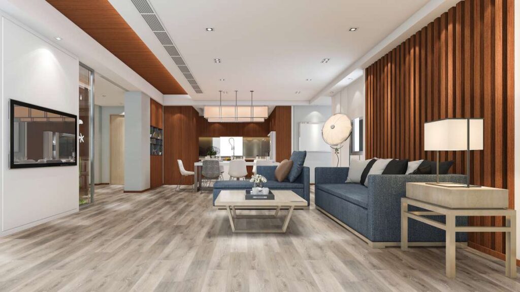 Sala descorada, contendo sofá, TV, Painel ripado e objetos decorados, com ênfase no piso vinílico